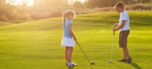 Stock Photo - youth playing golf