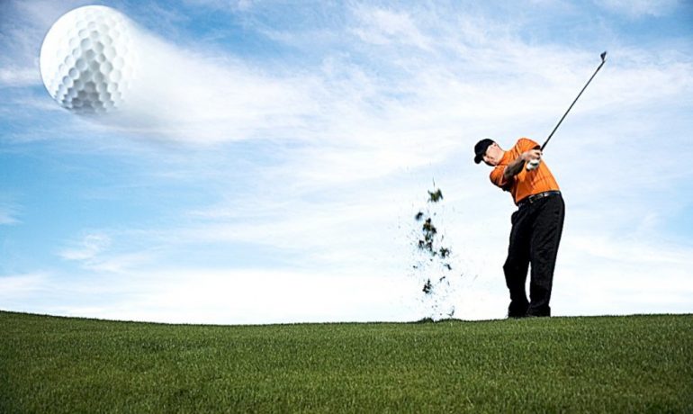 stock photo - golfer hitting ball