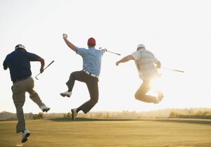 Golfers Jumping Midshot